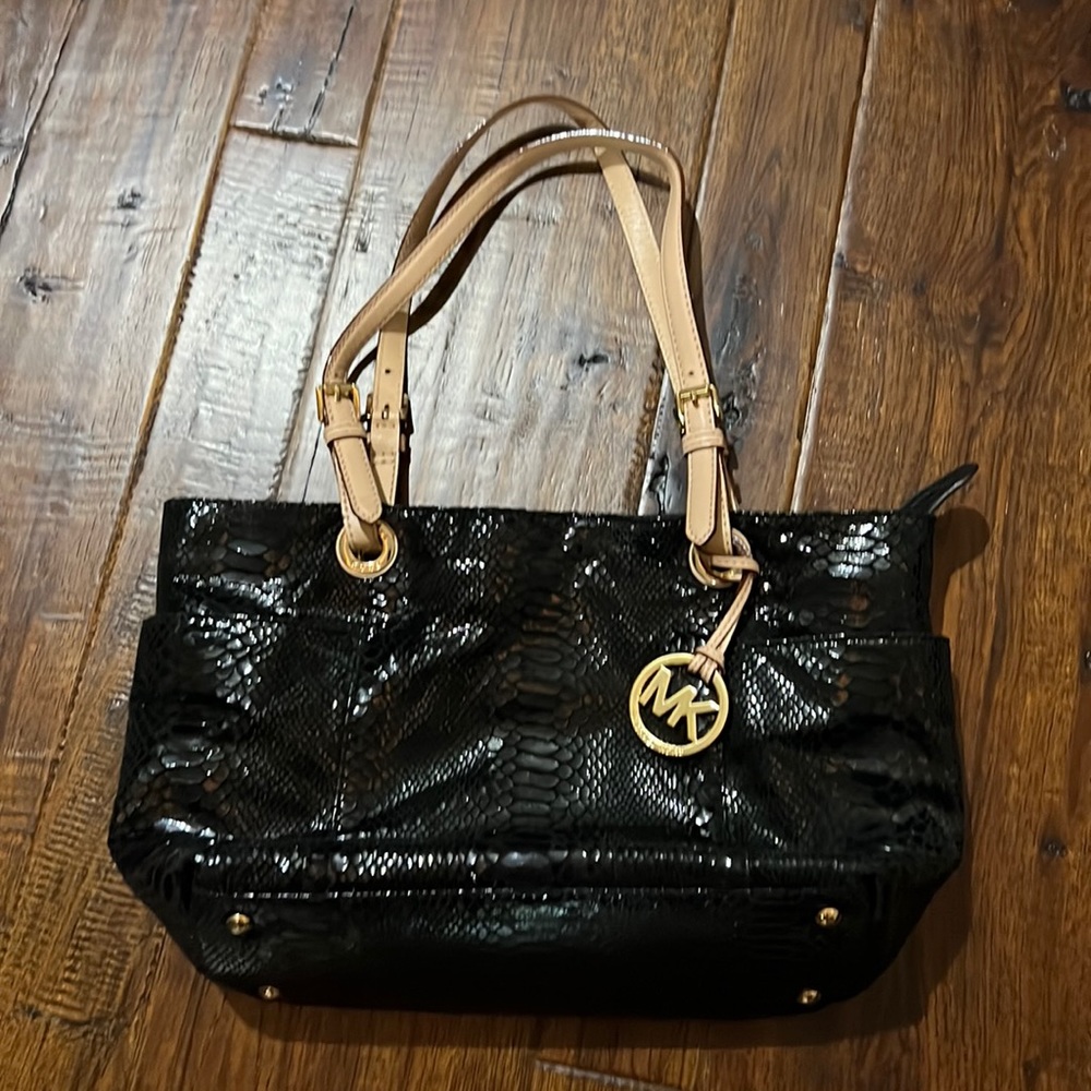 Micheal kors black snack skin like material with gold interior